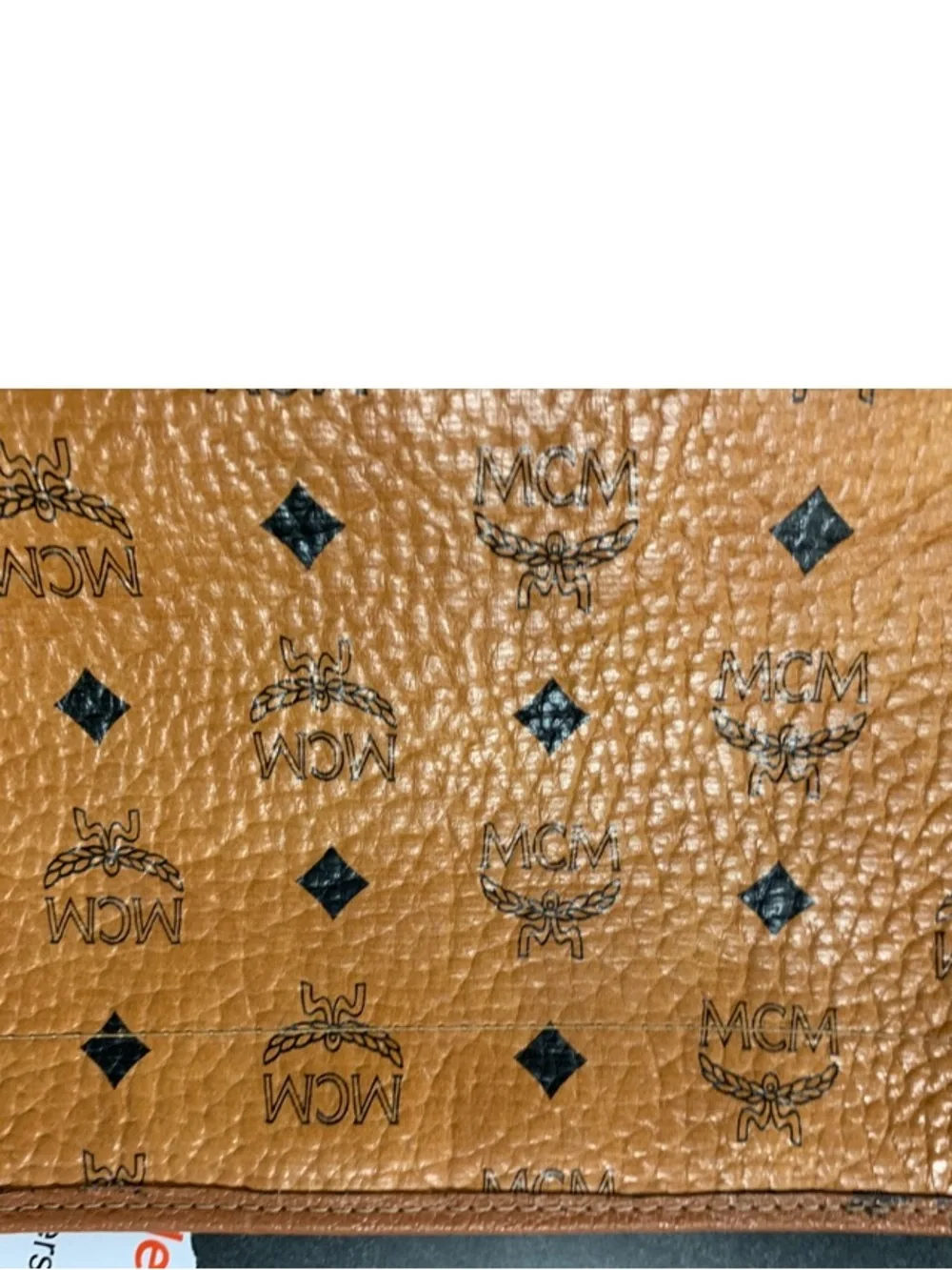 MCM Cognac and Black Visetos Monogram Pouch with Gold Plaque.